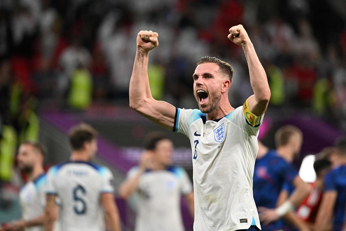 England's midfielder #08 Jordan Henderson celebrates after England won the Qatar 2022 World Cup Group B football match between Wales and England. Credit: AFP Photo