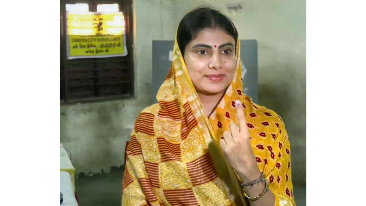 BJP candidate Rivaba Jadeja shows her finger marked with indelible ink after casting her vote in Rajkot. Credit: PTI Photo