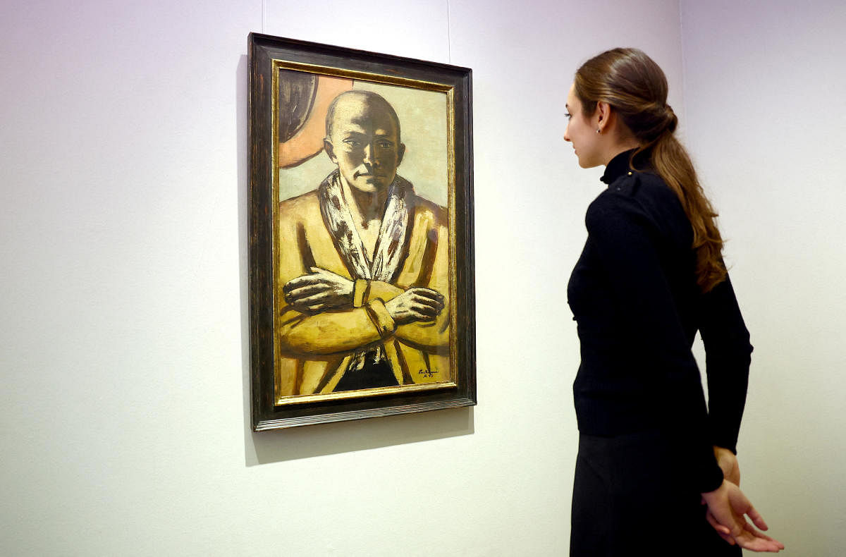 A woman looks at a self-portrait of German artist Max Beckmann, estimated to be worth $20 to 30 million. Credit: Reuters Photo
