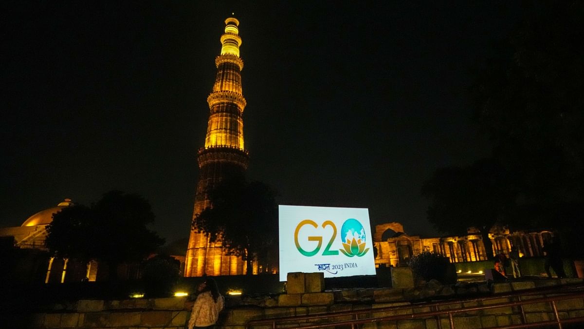 The G20 Summit 2023 logo at the illuminated Qutub Minar in New Delhi. Credit: PTI Photo