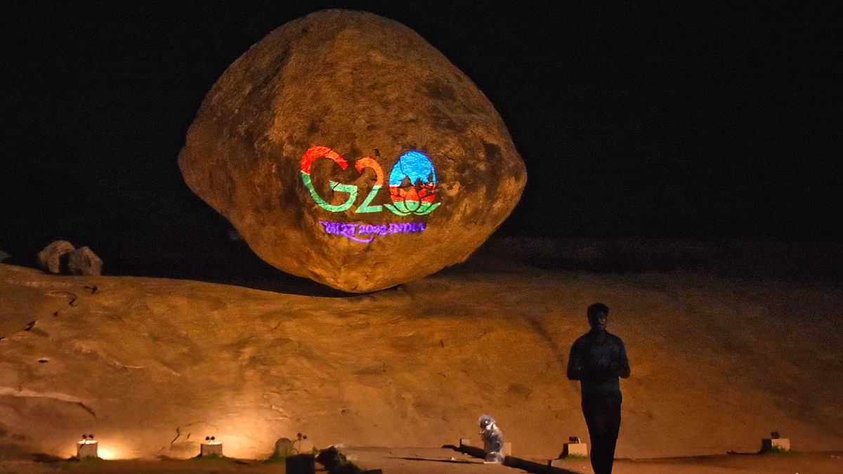 Krishna's Butterball is illuminated displaying the logo of G20 Summit in Mamallapuram. Credit: PTI Photo