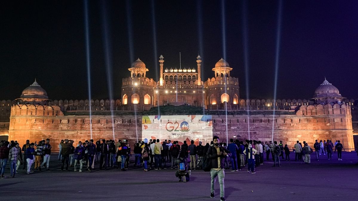 The logo of G20 Summit 2023 displayed on the wall of the Red Fort in New Delhi. Credit: PTI Photo