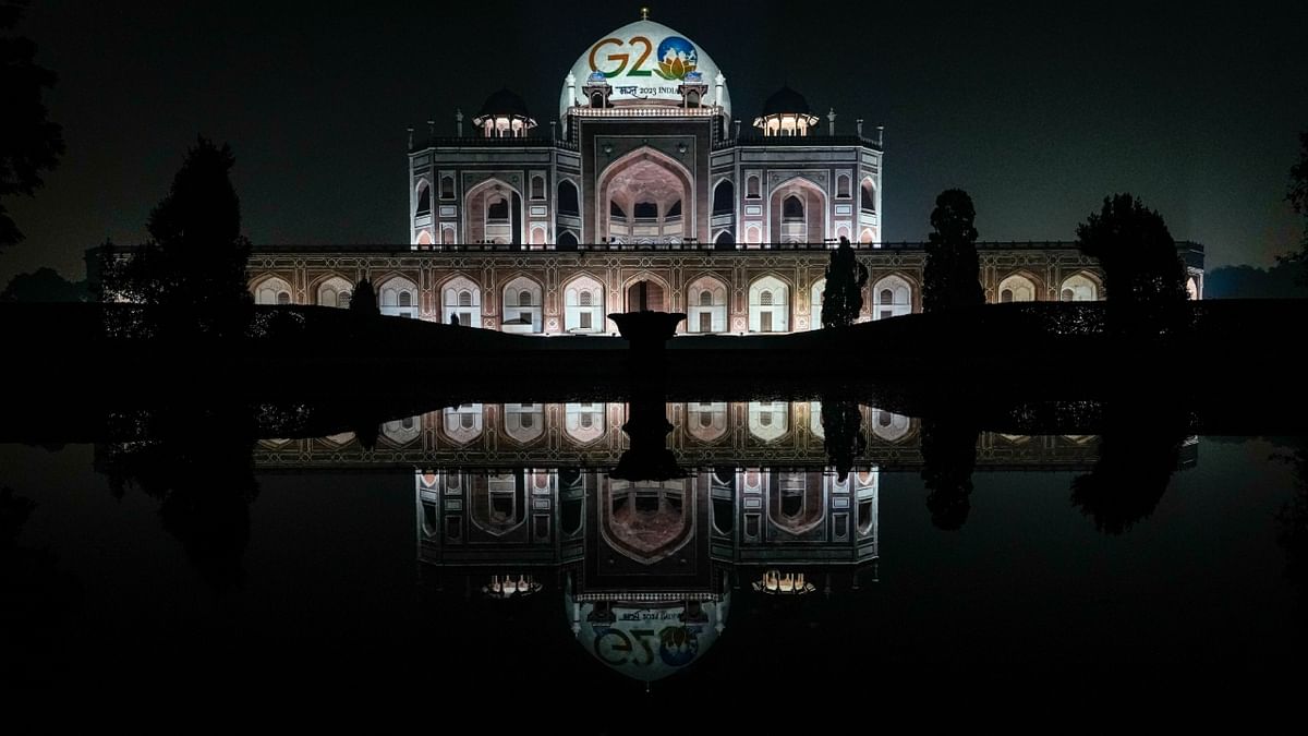 An illuminated Humayun's Tomb displays the logo of G20 Summit 2023 in New Delhi. Credit: PTI Photo