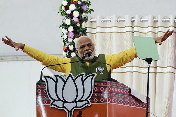Prime Minister Narendra Modi gestures as he speaks during a Bhartiya Janta Party (BJP) rally ahead of 2nd phase of Gujarat's assembly election, in Ahmedabad. Credit: AFP Photo