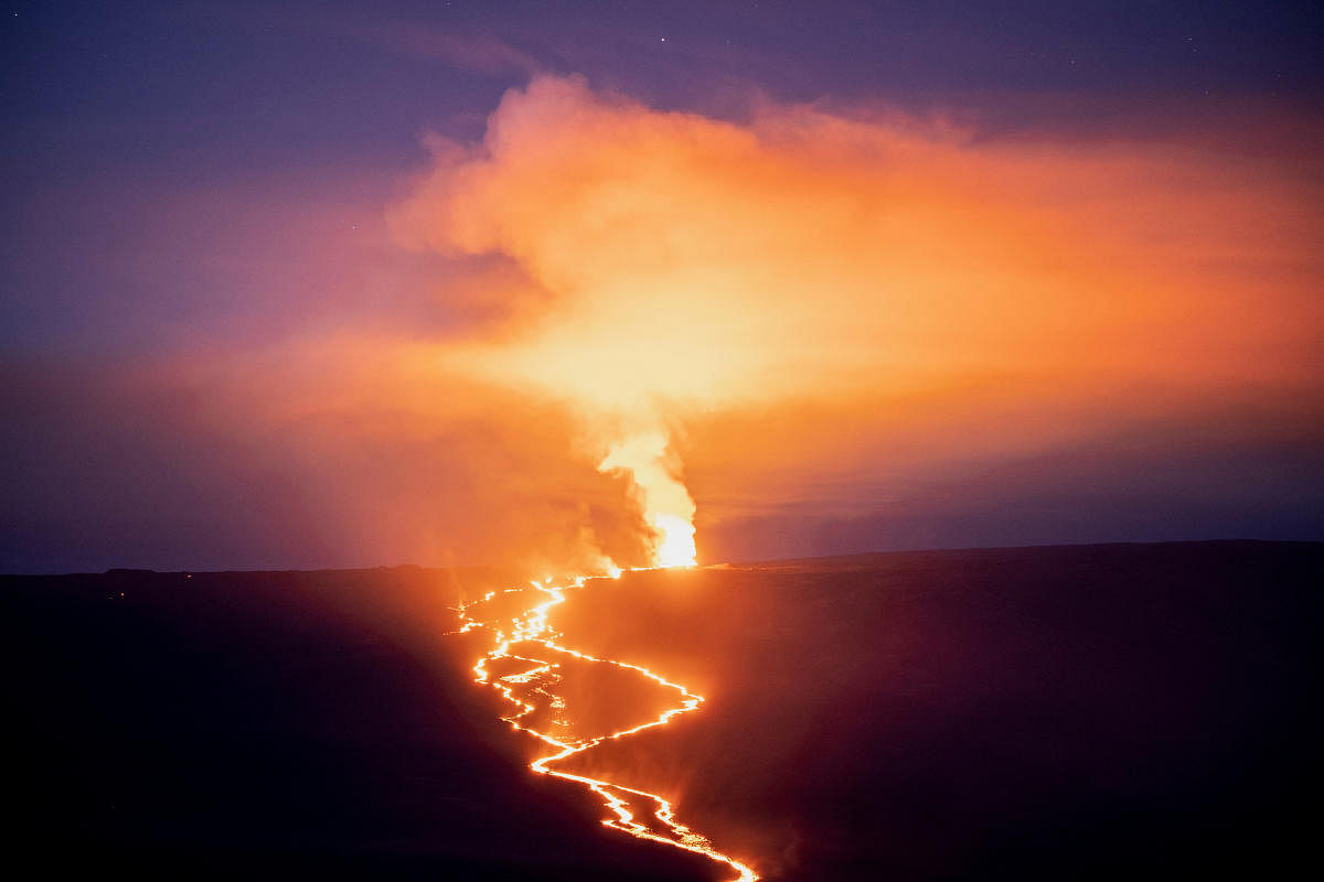 Lava fountains and flows illuminate the area with a glow during the Mauna Loa volcano eruption in Hawaii. Credit: Reuters Photo