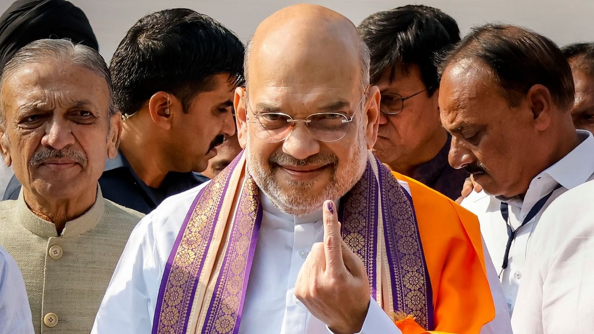 Home Minister Amit Shah after casting his vote at a polling booth during the second and final phase of Gujarat Assembly elections at Naranpura in Ahmedabad. Credit: PTI Photo
