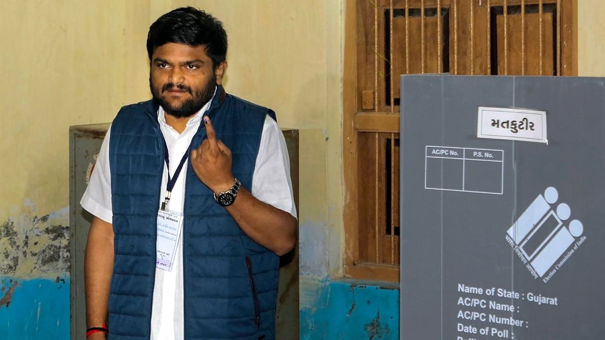 BJP candidate from Viramgam Hardik Patel shows his finger marked with indelible ink after casting his vote during the second and final phase of Gujarat Assembly elections in Ahmedabad. Credit: Twitter/@HardikPatel_
