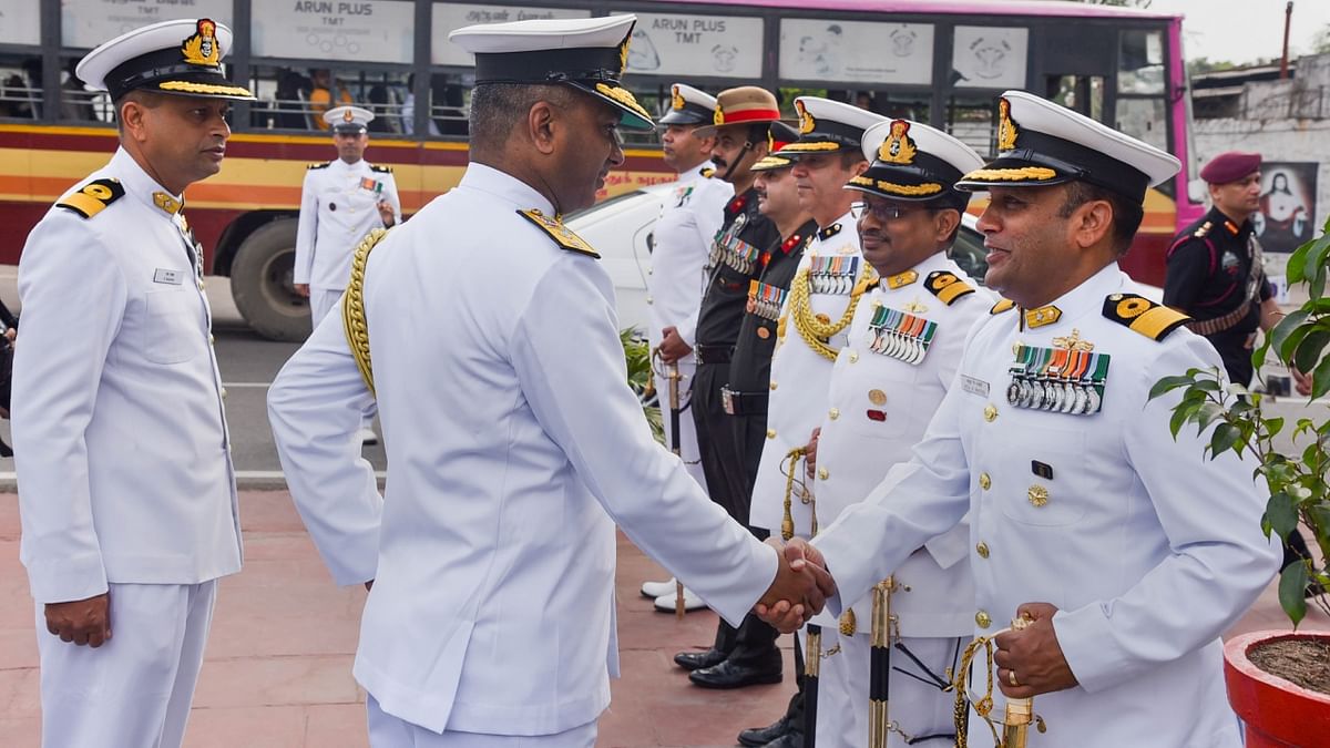 Rear Admiral S Venkat Raman, VSM, Flag Officer Commanding Tamil Nadu and Puducherry Naval Area, and others during the Navy Day celebrations at Victory War Memorial in Chennai. Credit: PTI Photo