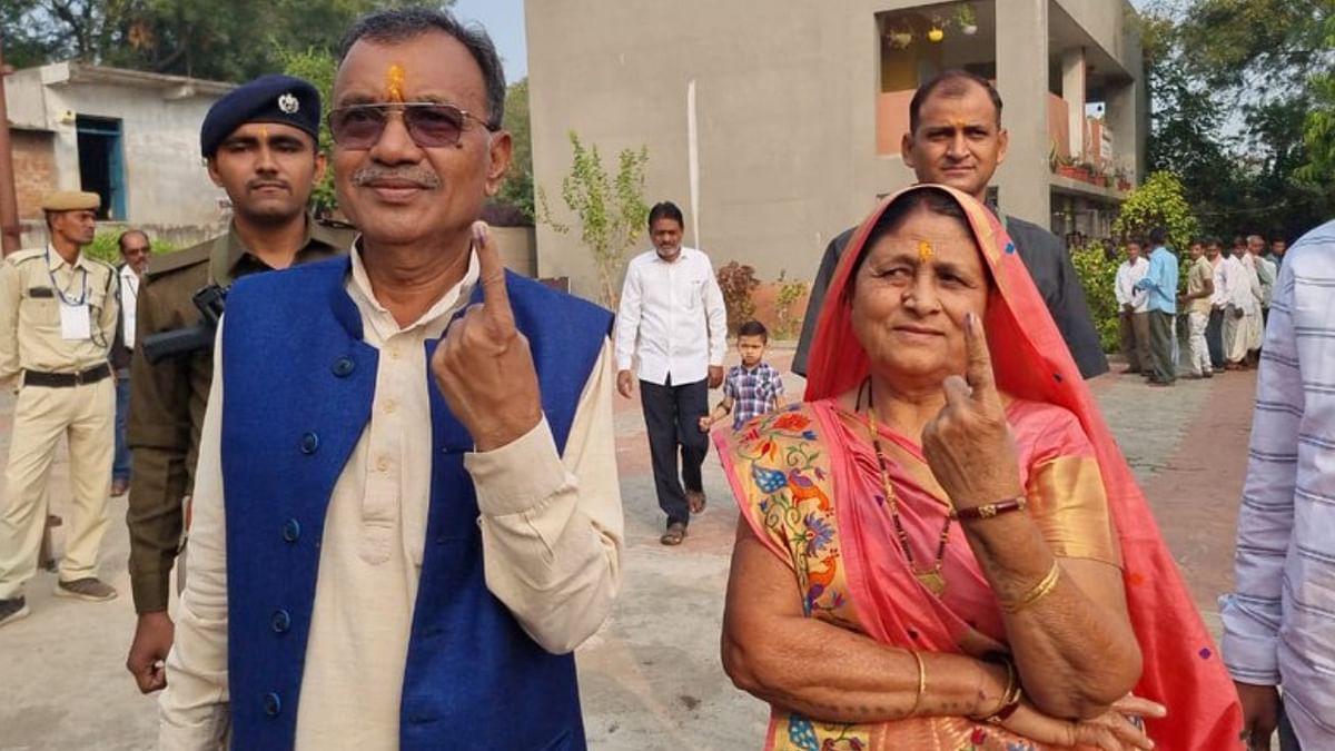 Sukhram Rathva and his wife after casting their vote. Credit: Twitter/@SukhramRathava