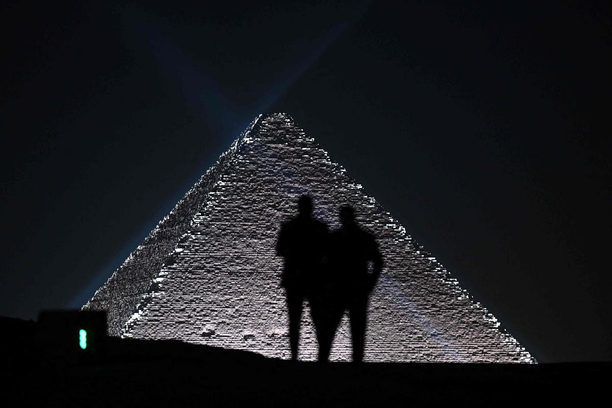 Models are silhoutted against the Pyramids at the Christian Dior fashion show at the Giza Pyramids Necropolis on the outskirts of the twin city of Egypt's capital. Credit: AFP Photo