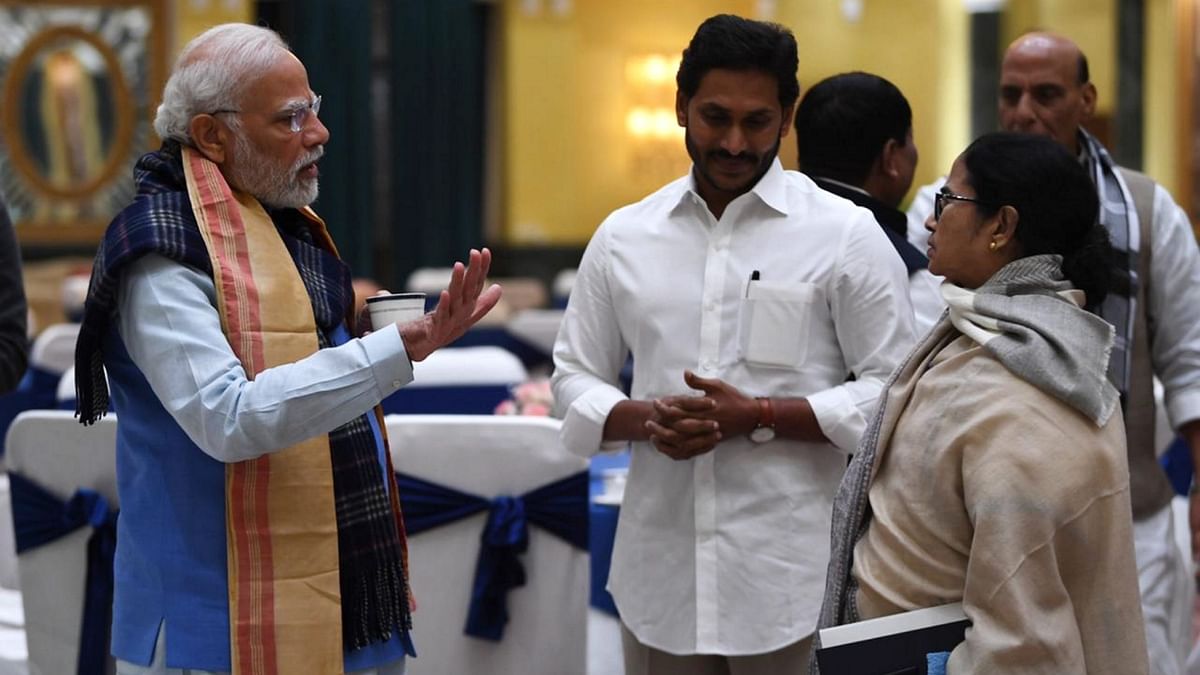 Prime Minister Narendra Modi in an intense discussion with Andhra Pradesh Chief Minister Jagan Mohan Reddy and West Bengal Chief Minister Mamata Banerjee during the all-party meeting on G20 summit, in New Delhi. Credit: PTI Photo