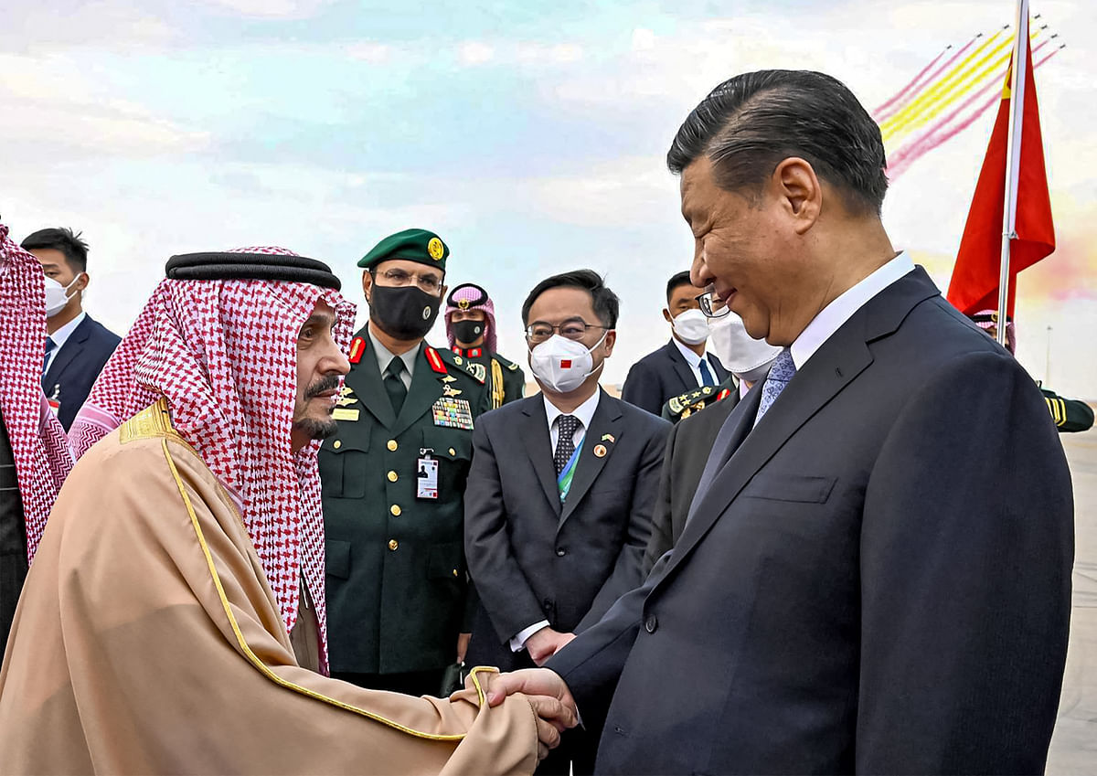 This handout picture released by the Saudi Press Agency SPA shows China's President Xi Jinping (R) being received by the Governor of Riyadh province Prince Faisal bin Bandar al-Saud (L). Credit: AFP Photo