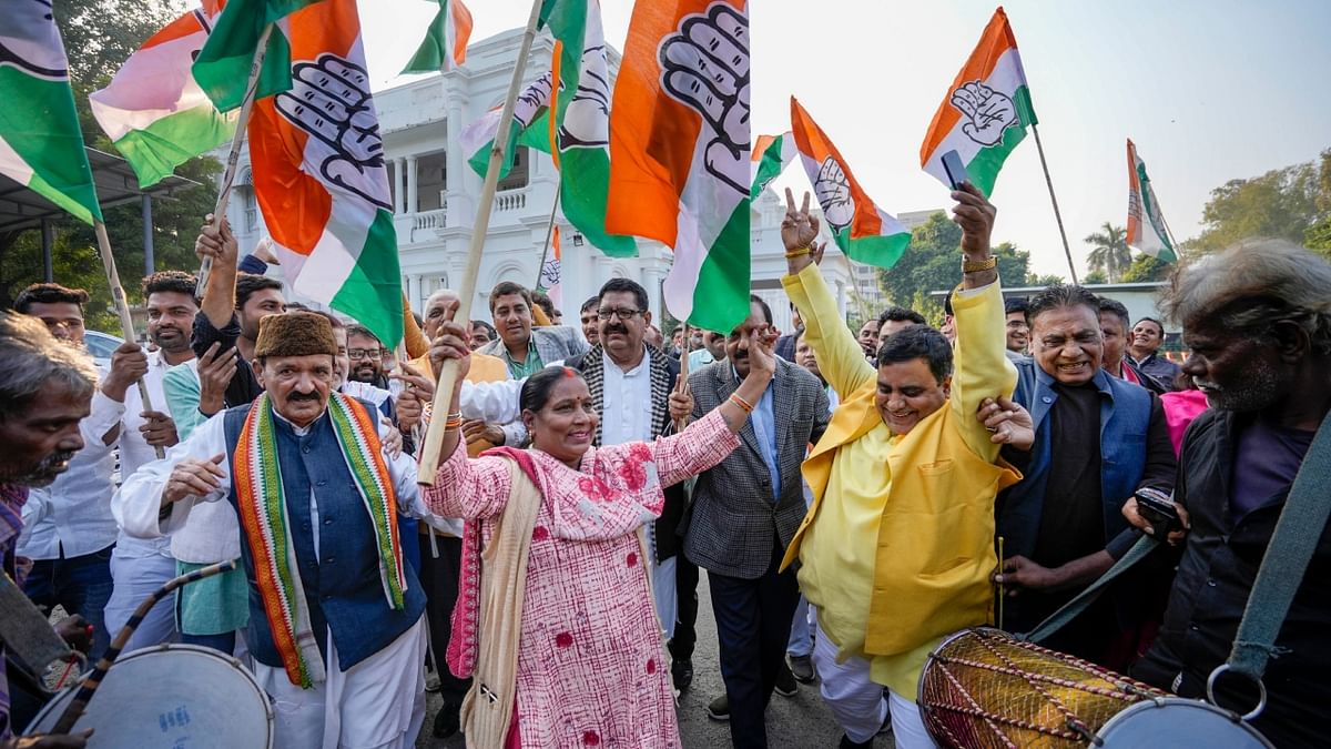 Congress workers celebrate the party's decisive lead in Himachal Pradesh Assembly Election, at the party office in Lucknow. Credit: PTI Photo