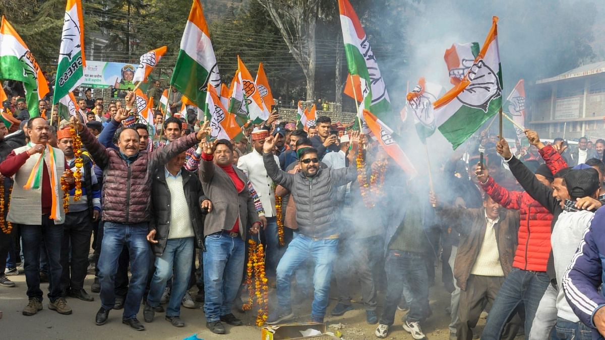 Congress workers celebrate the party's impressive performance in Himachal Pradesh Assembly elections, in Kullu. Credit: PTI Photo