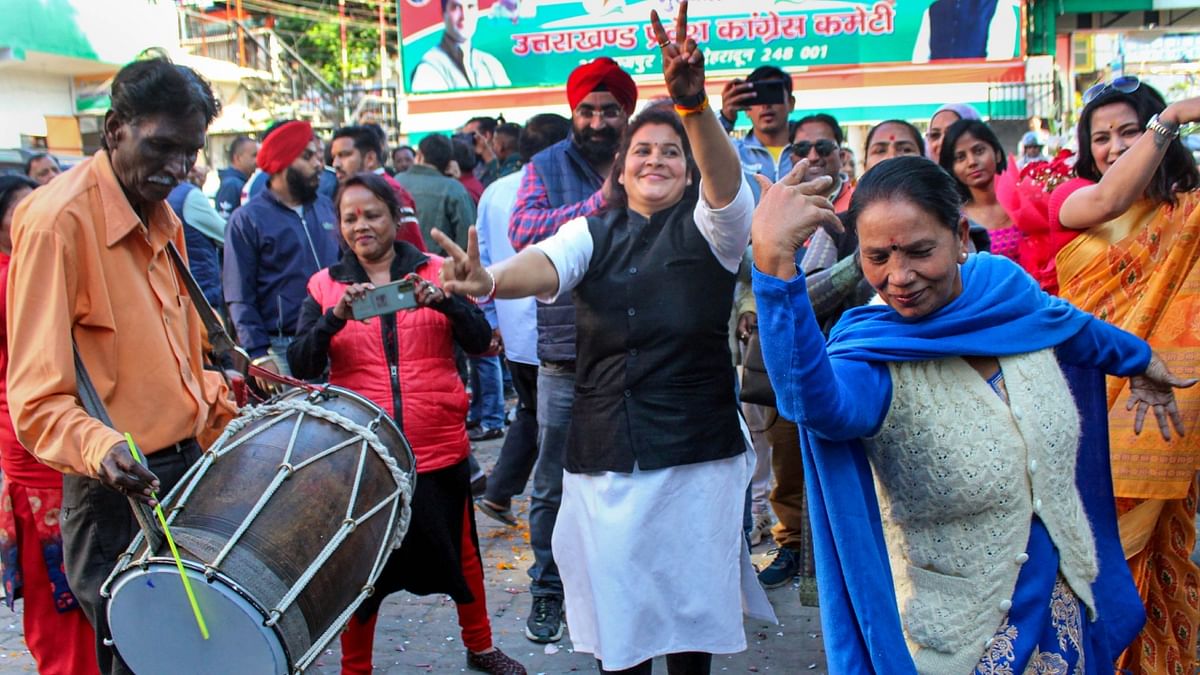 Congress leaders and workers dance to celebrate the party's decisive lead in Himachal Pradesh Assembly Election, in Dehradun. Credit: PTI Photo