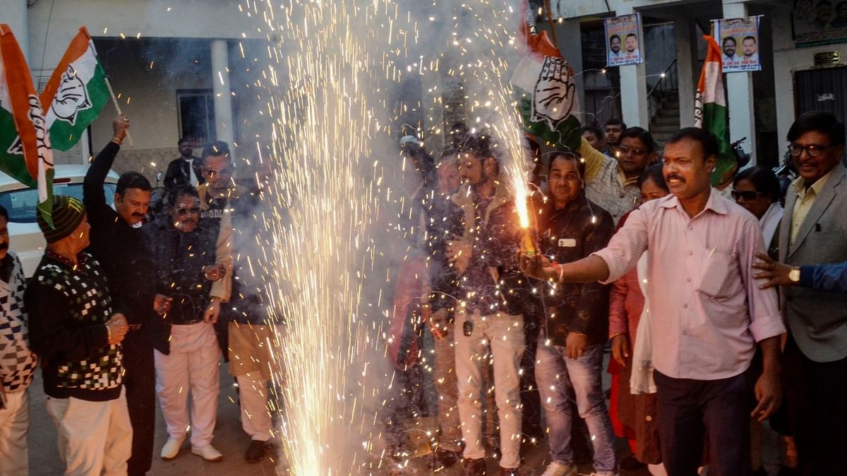Jharkhand Pradesh Congress Committee (JPCC) members celebrate party's win in HImachal Pradesh Assembly elections, in Ranchi. Credit: PTI Photo