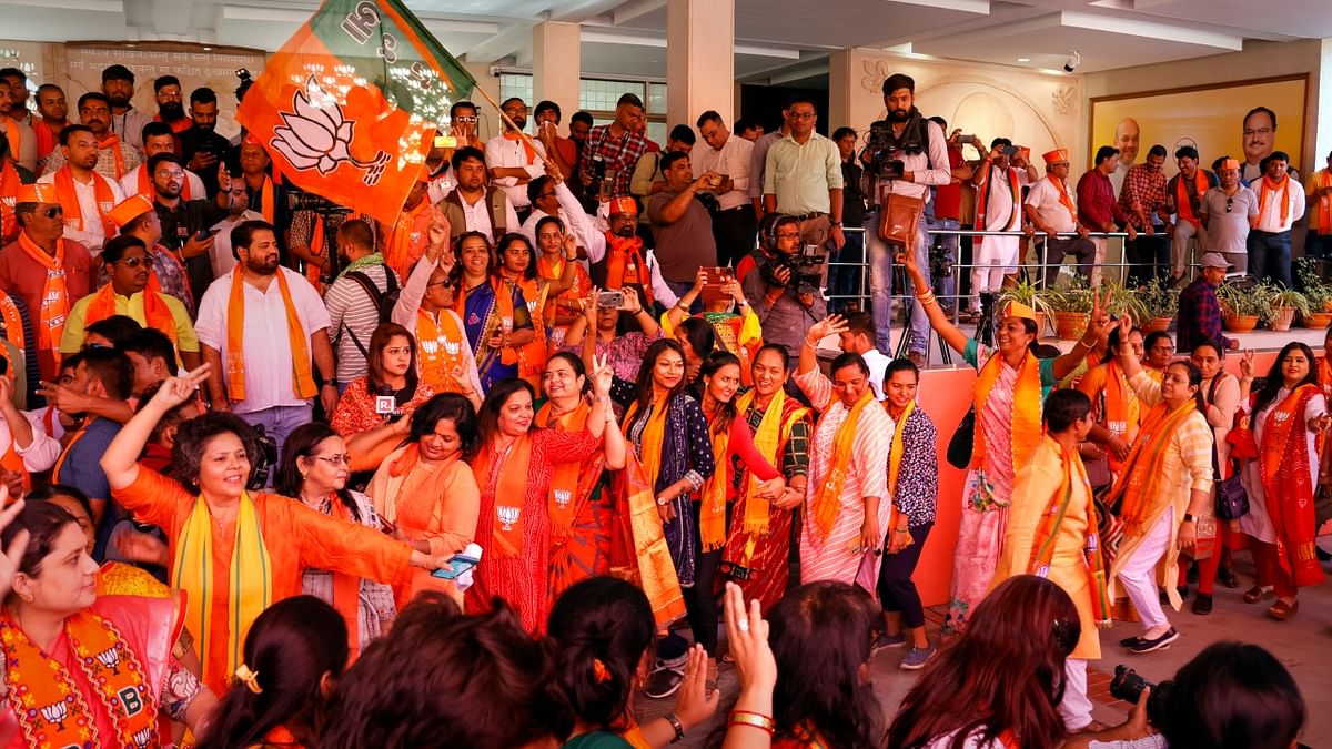 BJP leaders and workers dance to celebrate the party's victory in Gujarat Assembly elections, at the party headquarters in Gandhinagar. Credit: PTI Photo