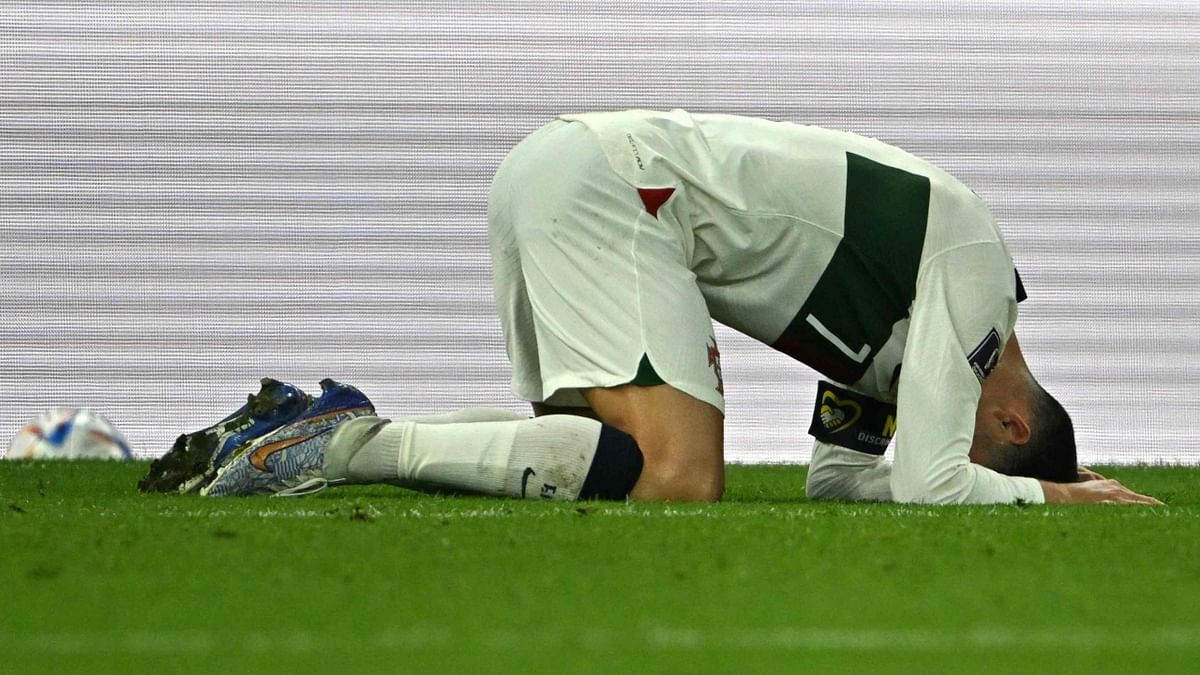 Cristiano Ronaldo looks dejected after his team's loss to Morroco during the Qatar 2022 World Cup quarter-final football match at the Al-Thumama Stadium in Doha. Credit: AFP Photo