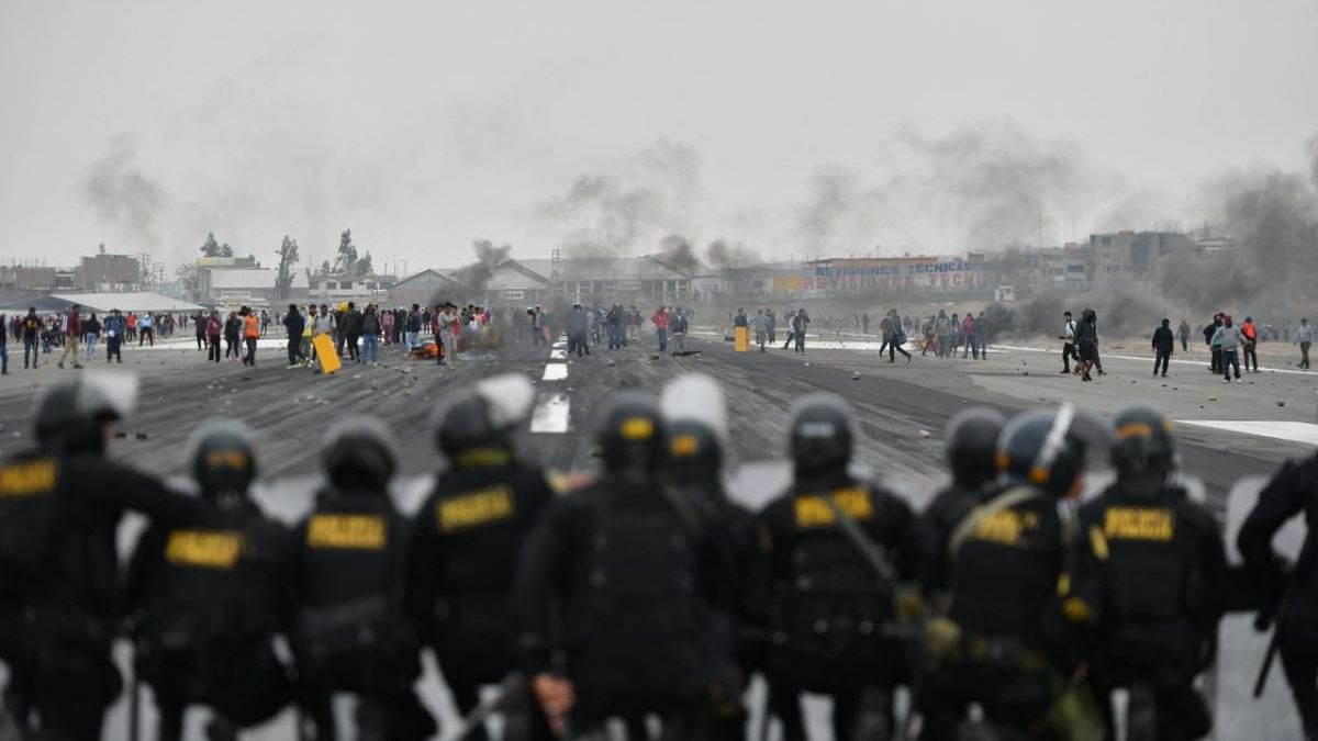 Protestors take over the Alfredo Rodriguez Ballon international airport following the announcement by Peruvian new President Dina Boluarte of her intention of presenting a bill to parliament to advance the scheduled general elections from April 2026 to April 2024 in Arequipa, Peru. Credit: AFP Photo