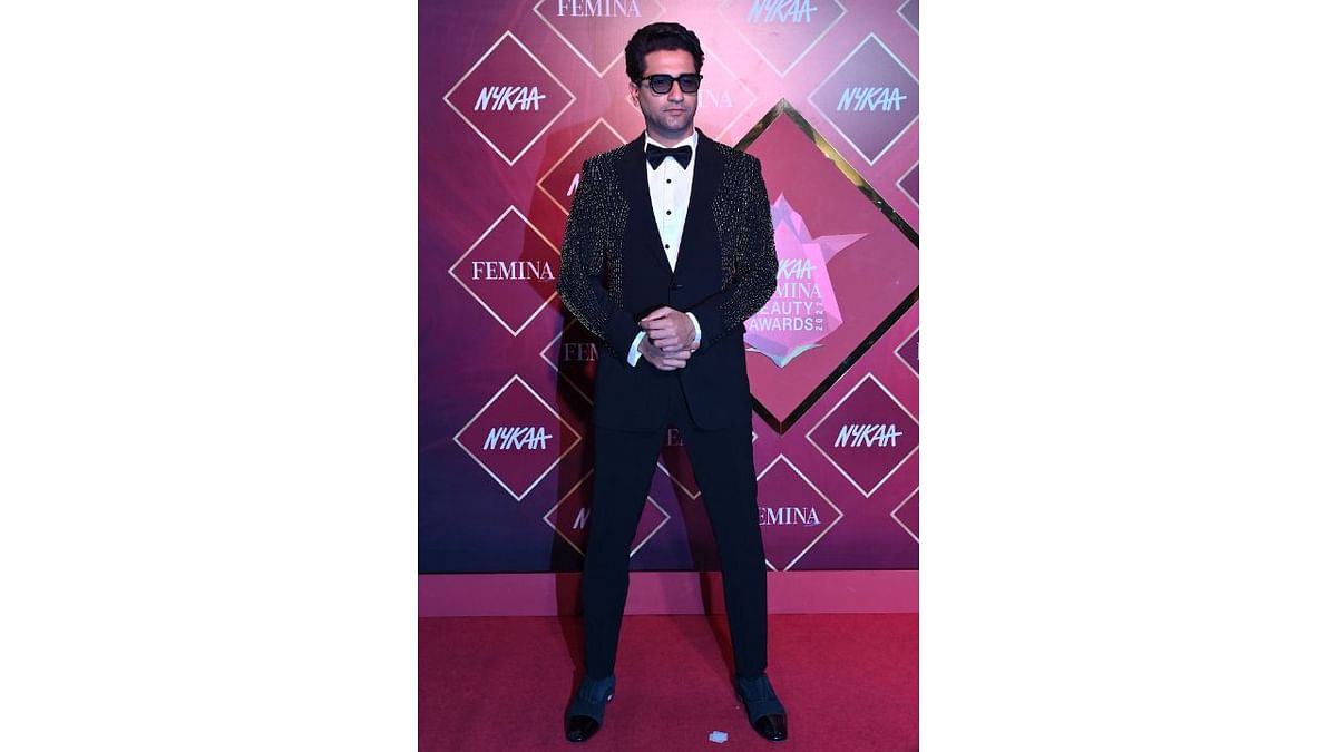 Vicky Kaushal looked dapper in a black and white tuxedo as he posed on the red carpet. Credit: AFP Photo