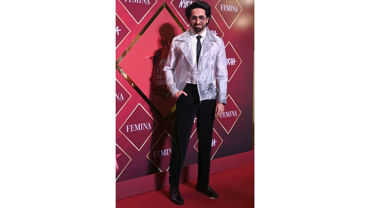 Ayushmann Khurrana, who was all smiles for the photographers, looked sharp on the red carpet. Credit: AFP Photo