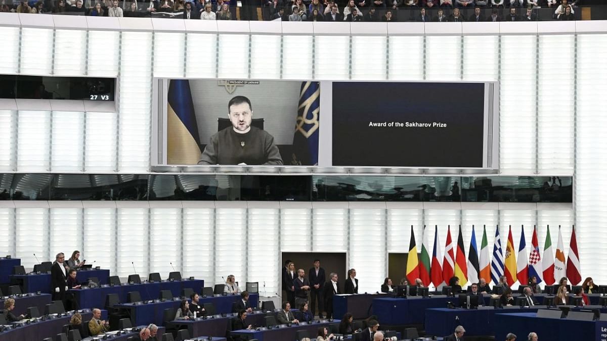 Ukrainian President Volodymyr Zelensky appears on a screen as he speaks in a video conference as the representatives of the Ukrainian people receive the 2022 European Parliament's Sakharov human rights prize during an award ceremony at the European Parliament in Strasbourg. Credit: AFP Photo