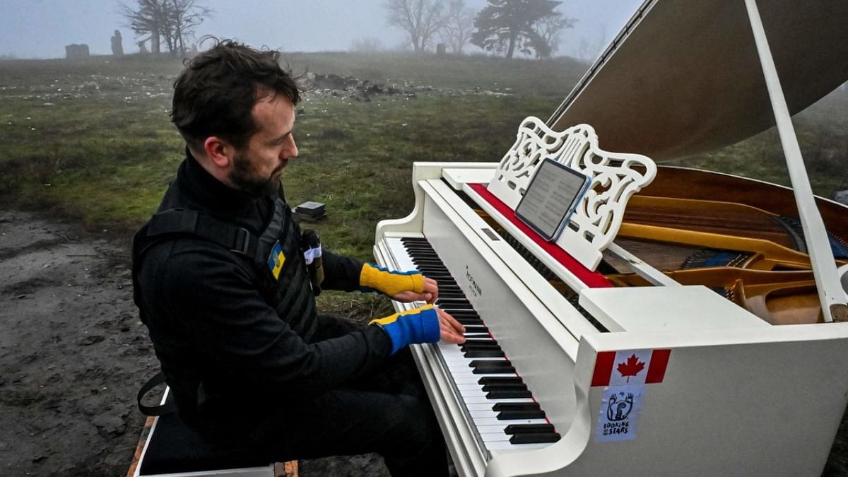 Lithuanian pianist Darius Majintas, playing music by Ukrainian composer Valentin Sylvestrov, on Kremyanets mountain in Izyum, Kharkiv region, amid the Russian invasion of Ukraine. Credit: AFP Photo