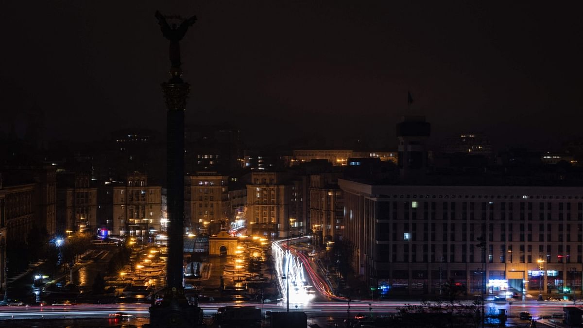 This photograph taken with a long exposure shows car lights near the Maidan square during an power cut in the city of Kyiv, on December 17, 2022, amid the Russian invasion of Ukraine. Credit: AFP Photo