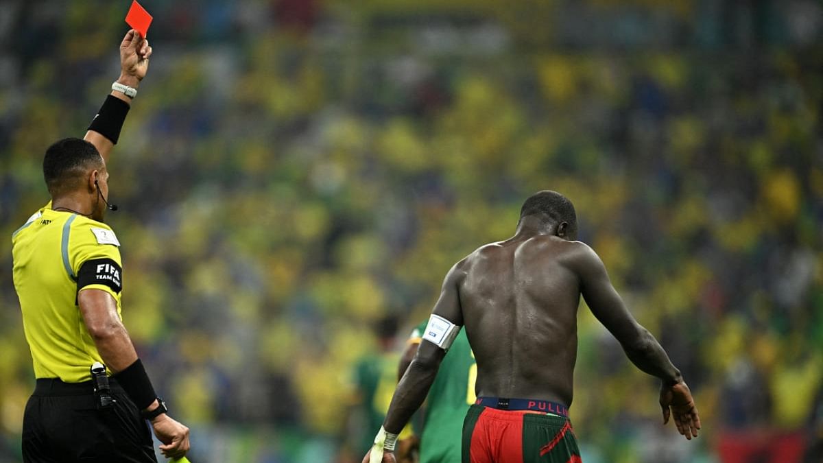 Football is as much a game of team effort as it is about individual talent. The 2022 World Cup has had plenty of players stepping up to the challenge like Cameroon's Aboubakar, who scored against Brazil and then got a red card from the referee for taking his shirt off. However, the player walked off the field with grace and the referee appreciated the sentiment as well. Credit: Reuters Photo