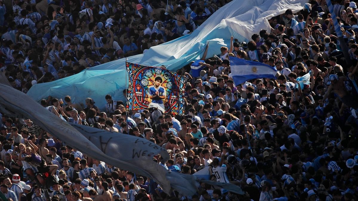 Tens of thousands of blue and white-shirted Argentina fans rose to salute Messi as he told them