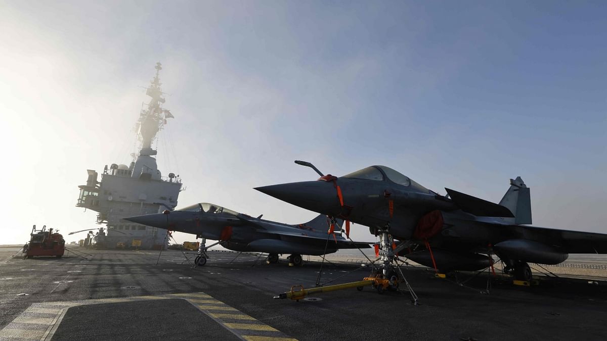 Rafale French air force aircrafts are parked on the flight deck abord the Charles de Gaulle French aircraft carrier, while cruising in Suez Canal, in Egypt, on December 18, 2022. Credit: AFP Photo