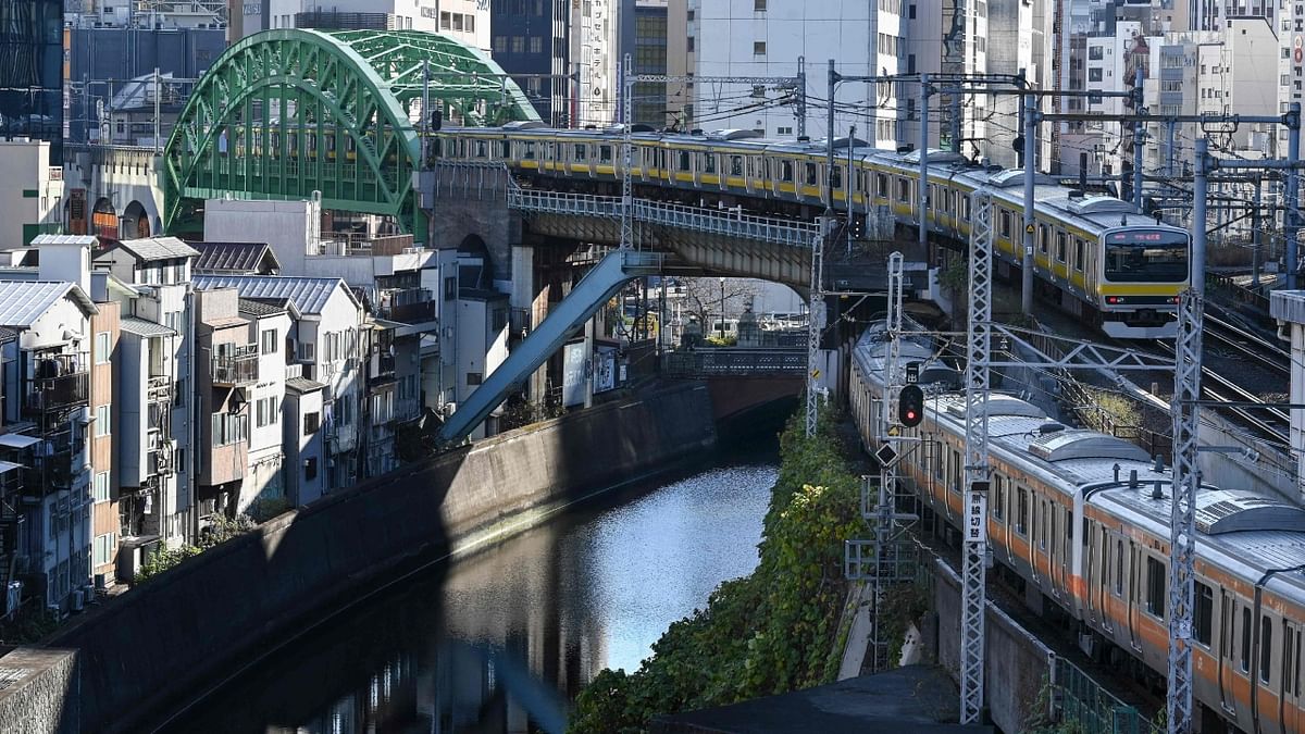 A train crosses over a bridge near Ochanomizu station in the centre of Tokyo on December 20, 2022. Credit: AFP Photo