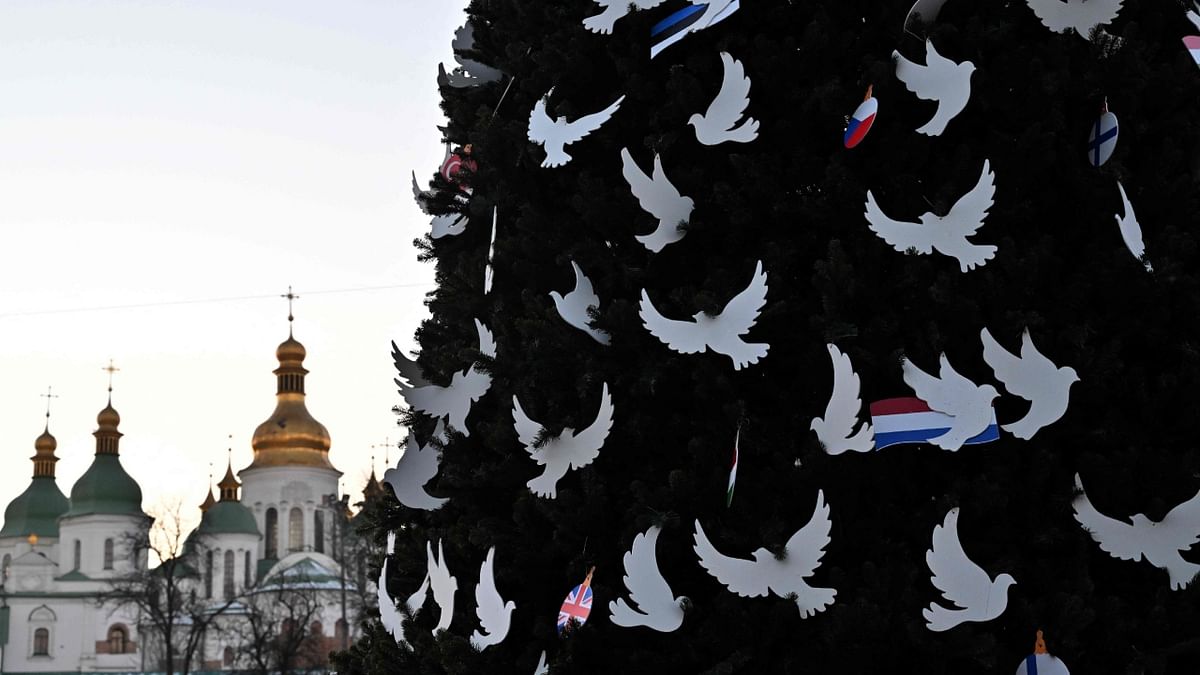 This photograph taken on December 19, 2022, shows Kyiv's main Christmas tree prior to its unveiling ceremony at St. Sophia Square in Ukrainian capital of Kyiv. Credit: AFP Photo