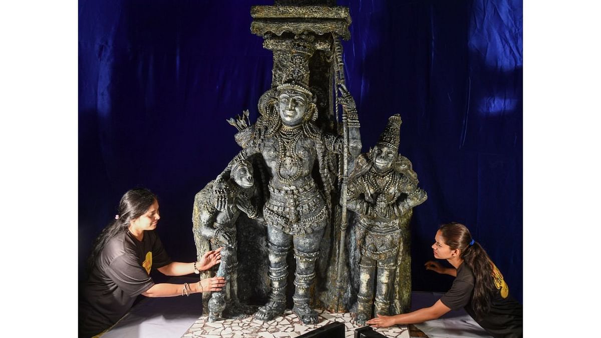 Bakers are seen giving a final touch to the Cake Sugar art during the upcoming 48th Annual Cake Show at St. Josphs School Grounds in Bengaluru. Credit: BH Shivakumar/DH Photo