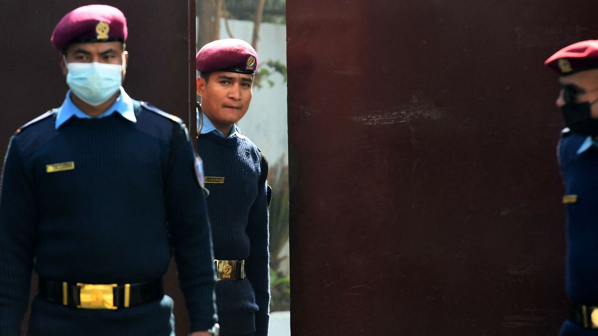Nepal police personnel stand guard at the entrance of the central Jail in Kathmandu. Credit: AFP Photo