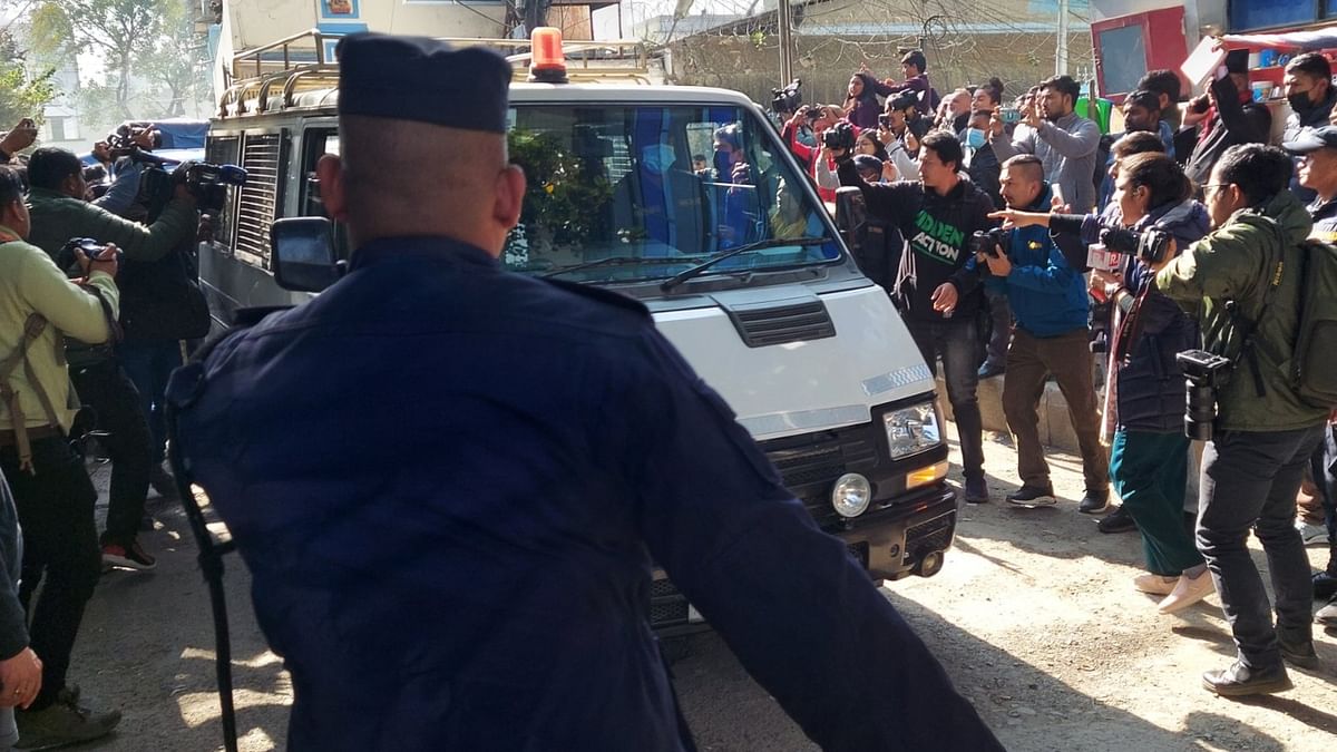 Sobhraj, 78, whose life was chronicled in the successful series 'The Serpent', was driven out of the prison in a blue police vehicle through a scrum of reporters. Credit: Twitter/@Binaj_APNepal