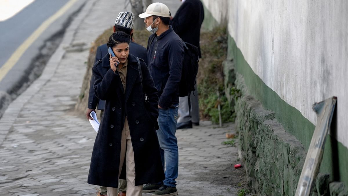 Nihita Biswas, who claims to be the wife of Charles Sobhraj, is seen walking outside the Department of Immigration where Sobhraj is taken after his release from prison, following an order of Nepal's Supreme Court, in Kathmandu. Credit: Reuters Photo