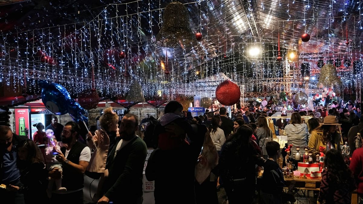 Hundreds of people are seen walking through a Christmas market in Byblos, Lebanon. Credit: Reuters Photo