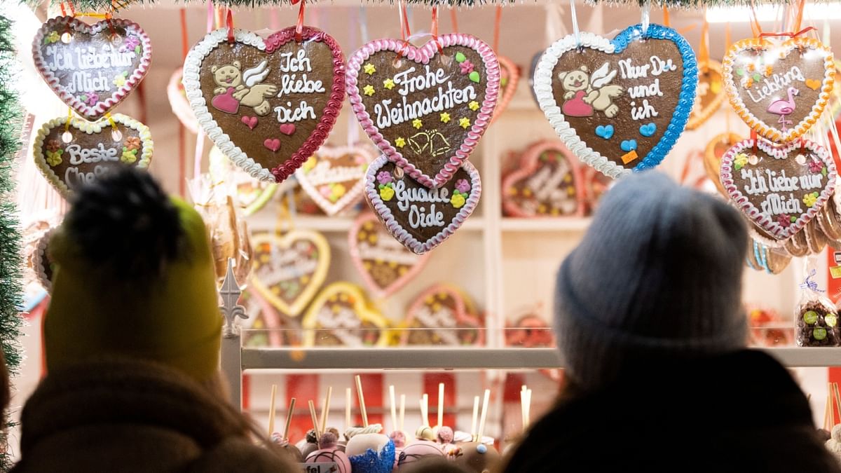 People attend the Viennese Christmas Market in City Hall Square in Vienna, Austria. Credit: Reuters Photo