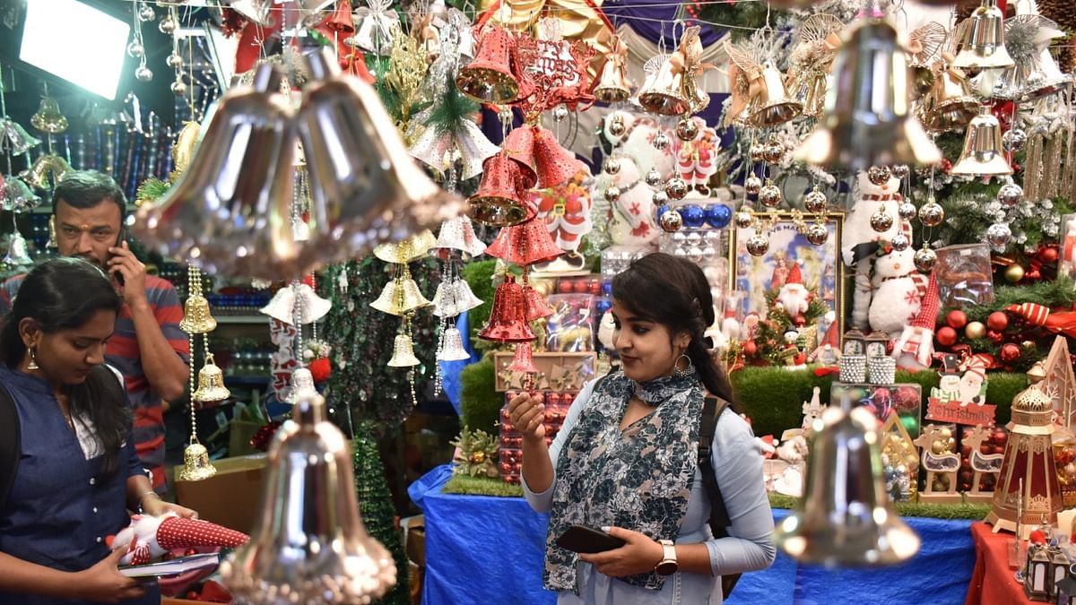 People are seen buying decorative items ahead of Christmas festival at a shop near Shivajinagar in Bengaluru. Credit: DH Photo