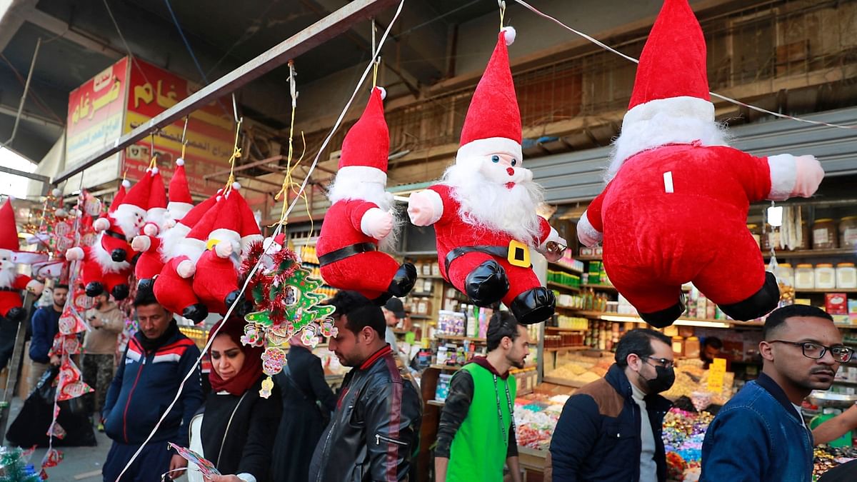 People in Iraq are seen shopping for Christmas goods at the Shorja market in Baghdad. Credit: AFP Photo