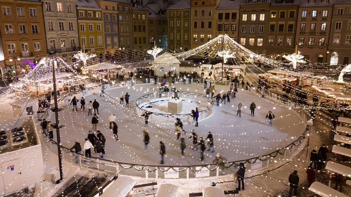 People skate on the ice rink at the Christmas market at the Old Town in Warsaw, Poland. Credit: Reuters Photo