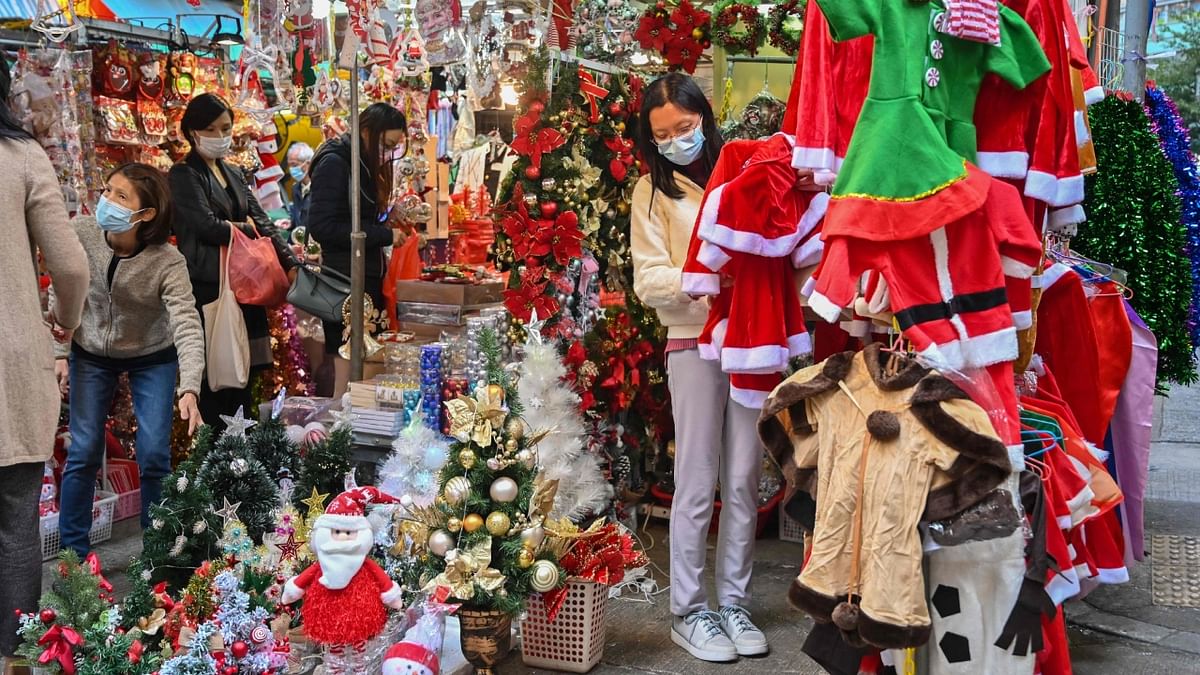 People shop for Christmas items at a market in Hong Kong. Credit: Reuters Photo