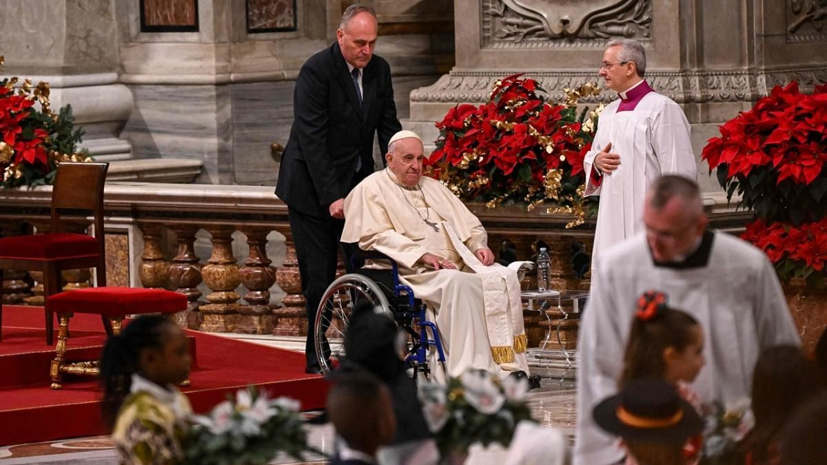 Pope Francis (C) attends the Christmas Eve mass at The St Peter's Basilica in the Vatican. Credit: AFP Photo