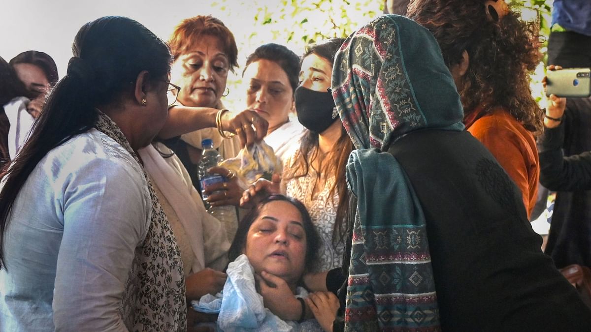 Sharma's mother Vanita Sharma was inconsolable and fell unconscious during her daughter's last rites. Credit: PTI Photo