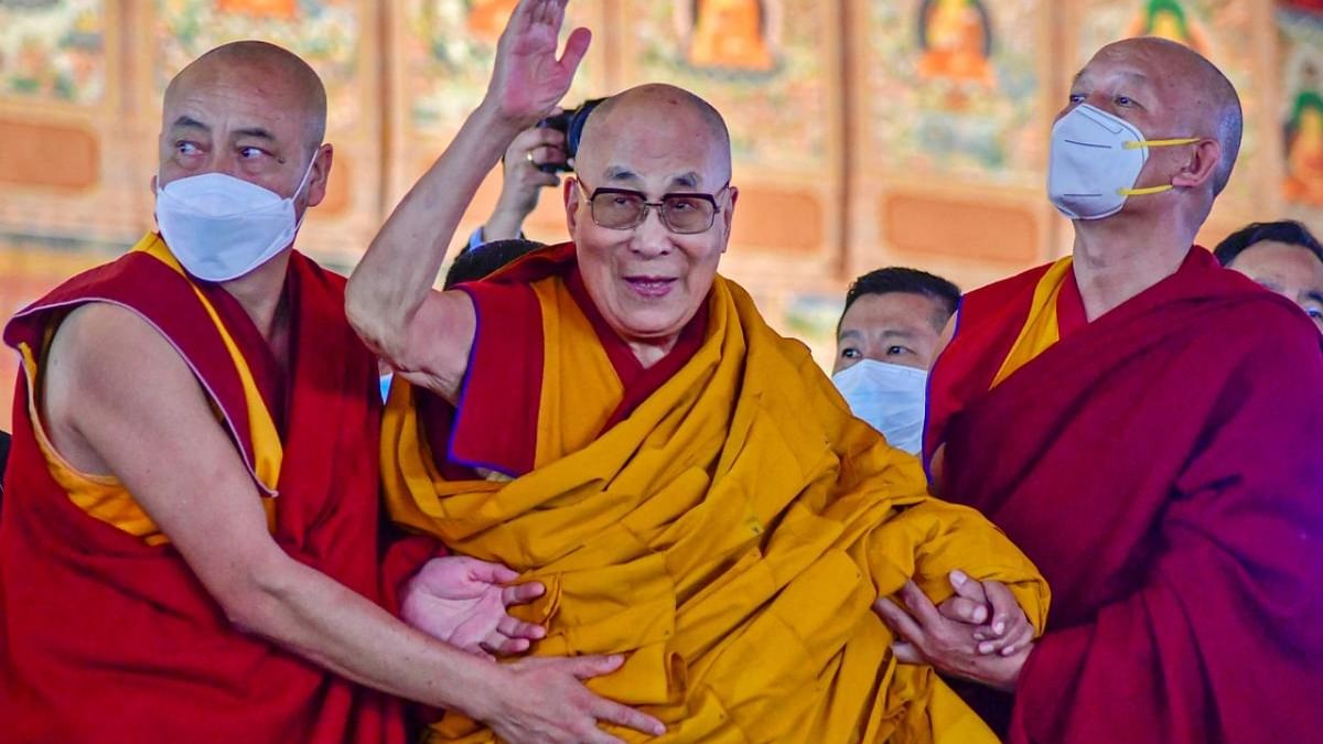 Tibetan spiritual leader Dalai Lama waves during his first day of teaching session at the Kalachakra Ground in Bodhgaya on December 29, 2022. Credit: AFP Photo