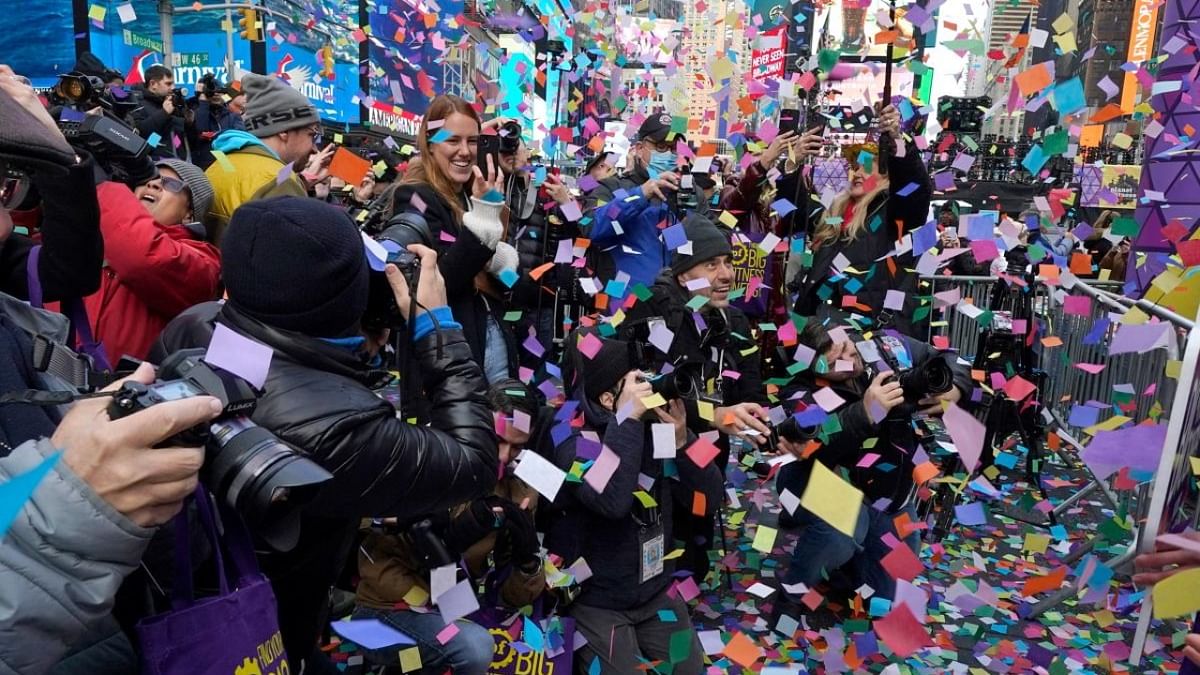 Photographers record a confetti test run in preparation for the New Year's Eve celebration in Times Square, New York City, on December 29, 2022. Credit: AFP Photo