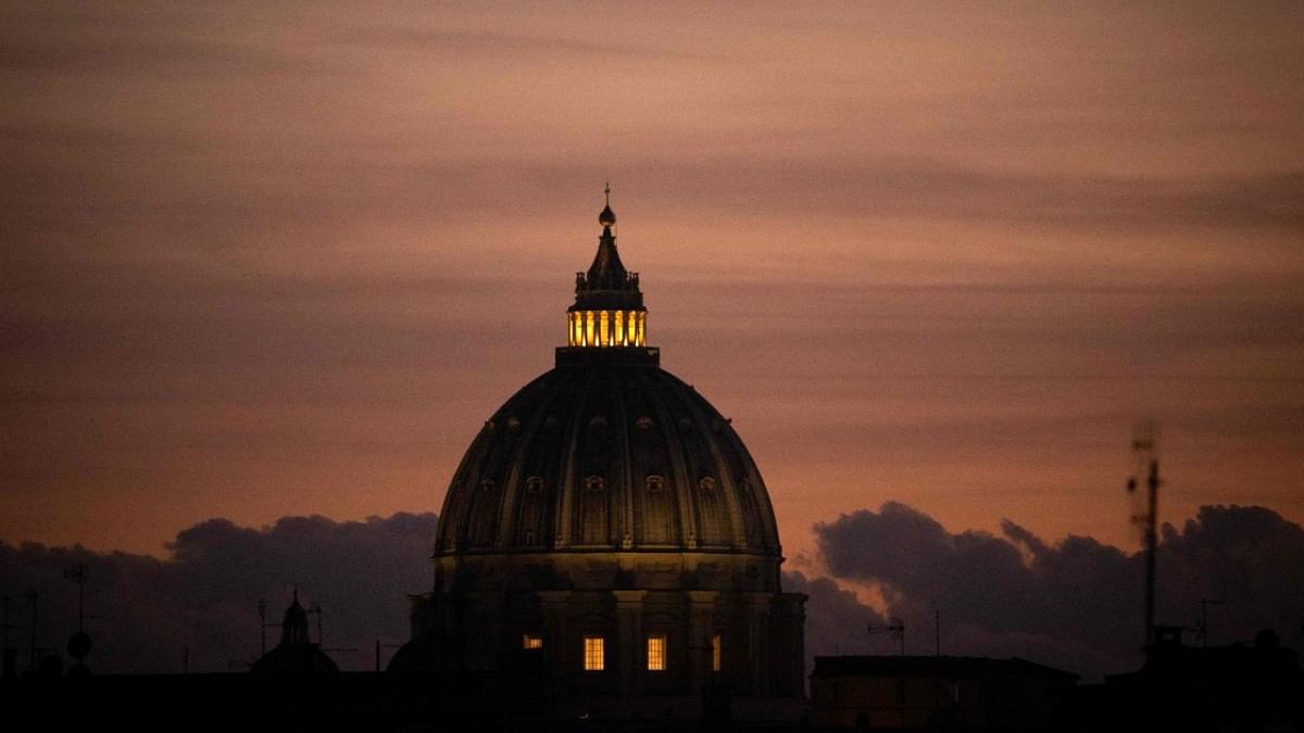 This photograph shows the dome of St. Peter's Basilica in Vatican City on December 29, 2022 at sunset. Former pope Benedict XVI's condition remains stable, the Vatican said on December 30, 2022, two days after revealing the 95-year-old's health had deteriorated. Credit: AFP Photo