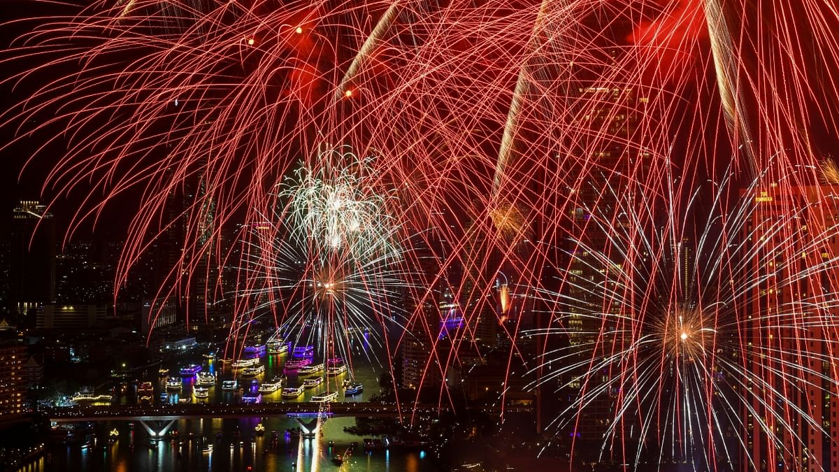 Fireworks explode over the Chao Phraya River during the New Year celebrations, in Bangkok, Thailand. Credit: AFP Photo