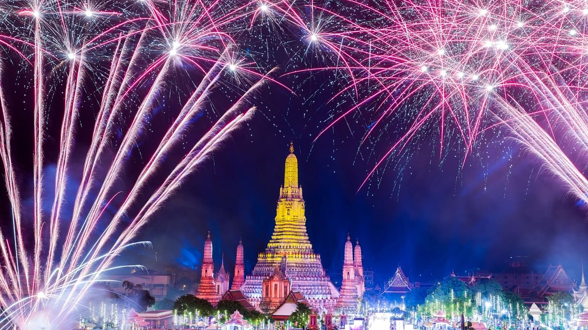 Fireworks explode over Wat Arun of the temple of dawn during the New Year celebrations, in Bangkok, Thailand. Credit: Reuters Photo